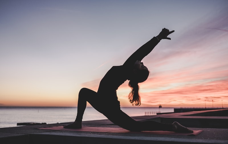 A patient doing a gentle guided stretch during a physiotherapy session